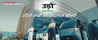 Mahindra Treo electric passenger auto-rickshaw in blue and white featuring a soft-top roof.